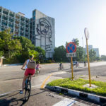 Young Woman Cycling in Plaza de la Revolución, Havana