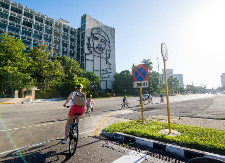 Young Woman Cycling in Plaza de la Revolución, Havana