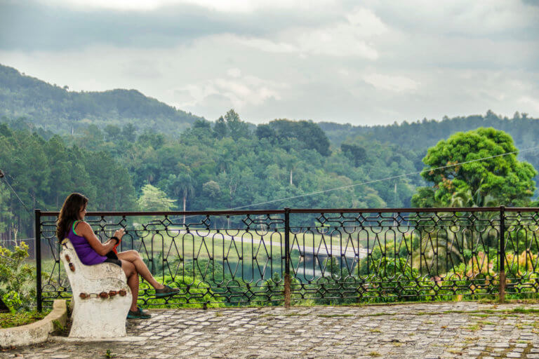 Woman Sitting with View of Las Terrazas Zip-line, Cuba