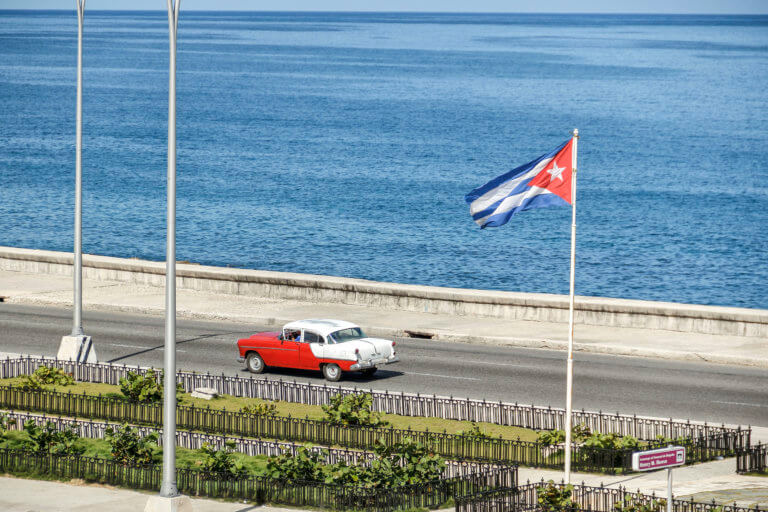 Cuban Car Driving Along the Malecón, HavanaCuban Car Driving Along the Malecón, Havana